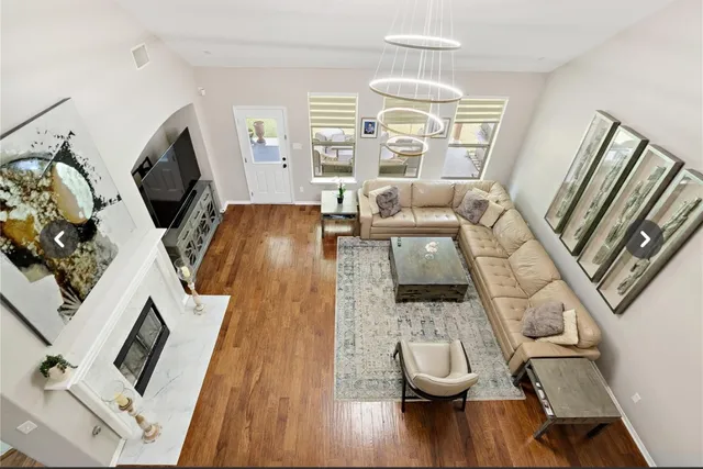 a living room with furniture and a fireplace