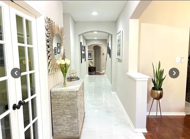 a view of a hallway with a potted plant