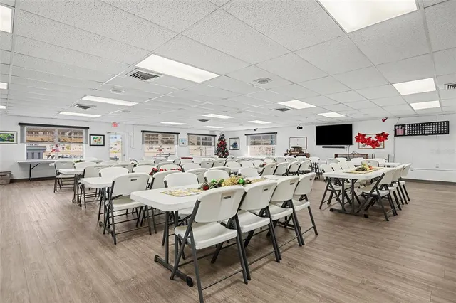 a living room with furniture a rug and a large window