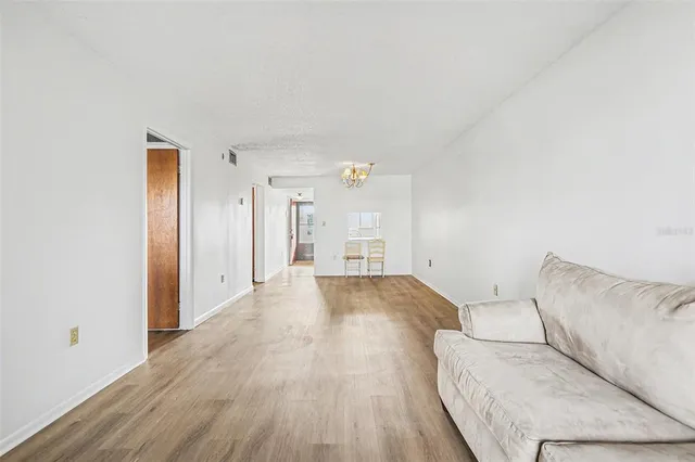 a view of a livingroom with furniture and wooden floor