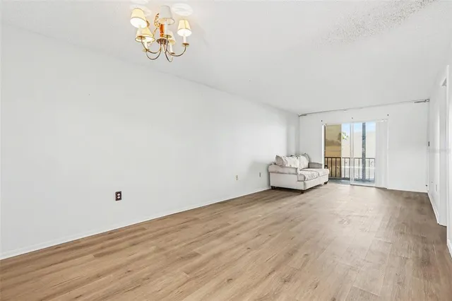 a view of livingroom with hardwood floor and ceiling fan