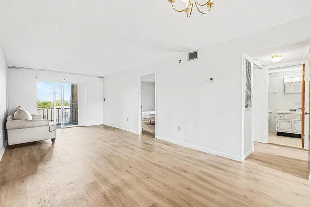 a view of livingroom with furniture and wooden floor