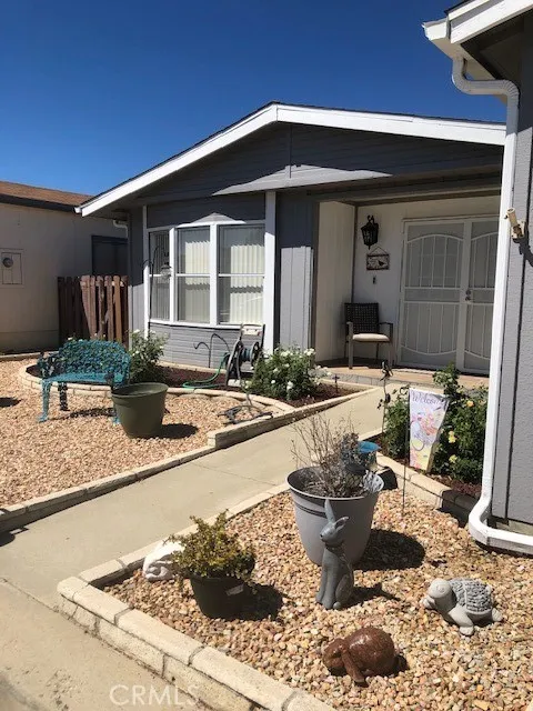a view of a living room and kitchen