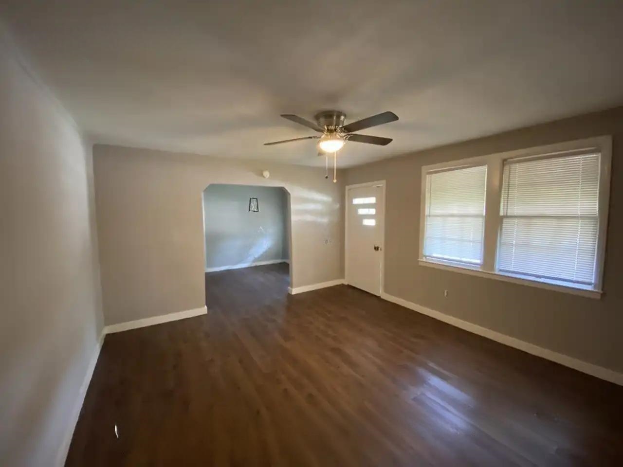 494 East Raines Road Memphis, TN 38109 - Photo 7 of 9 Spare room featuring ceiling fan and dark wood-type flooring