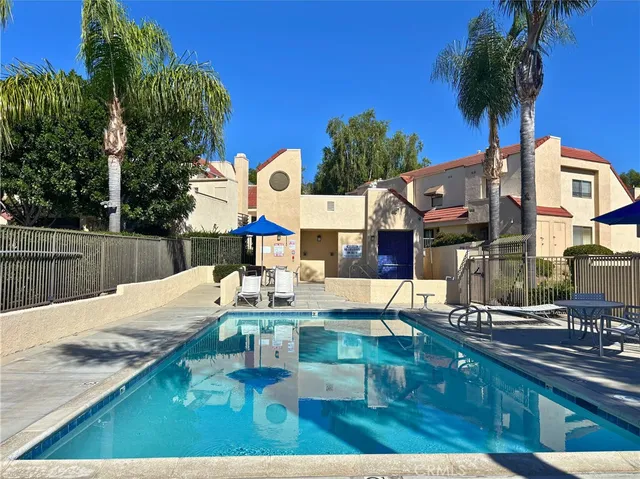 a sign that is sitting in front of flowers