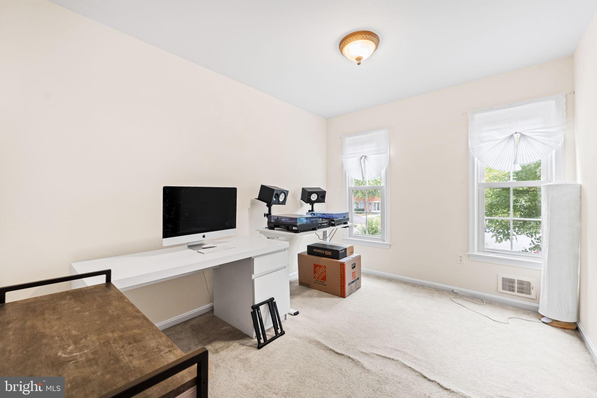 8000 Lady Lewis Court Springfield, VA 22153 - Photo 19 of 44 a view of a workspace with furniture and a window