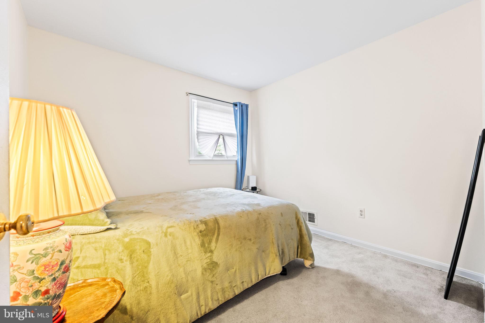 8000 Lady Lewis Court Springfield, VA 22153 - Photo 21 of 44 a bedroom with a bed and a window