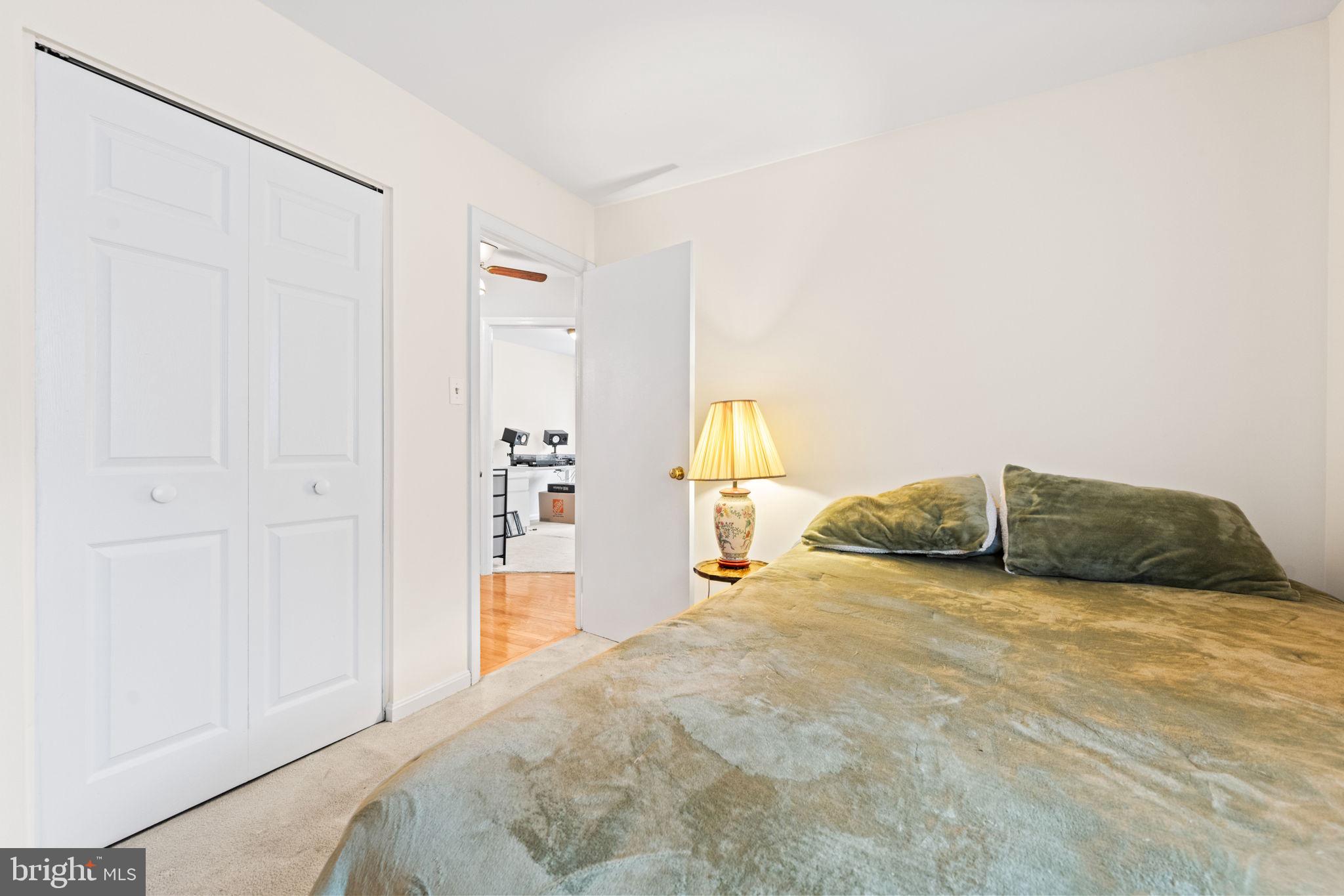 8000 Lady Lewis Court Springfield, VA 22153 - Photo 22 of 44 a view of a bedroom with a bed and cabinet