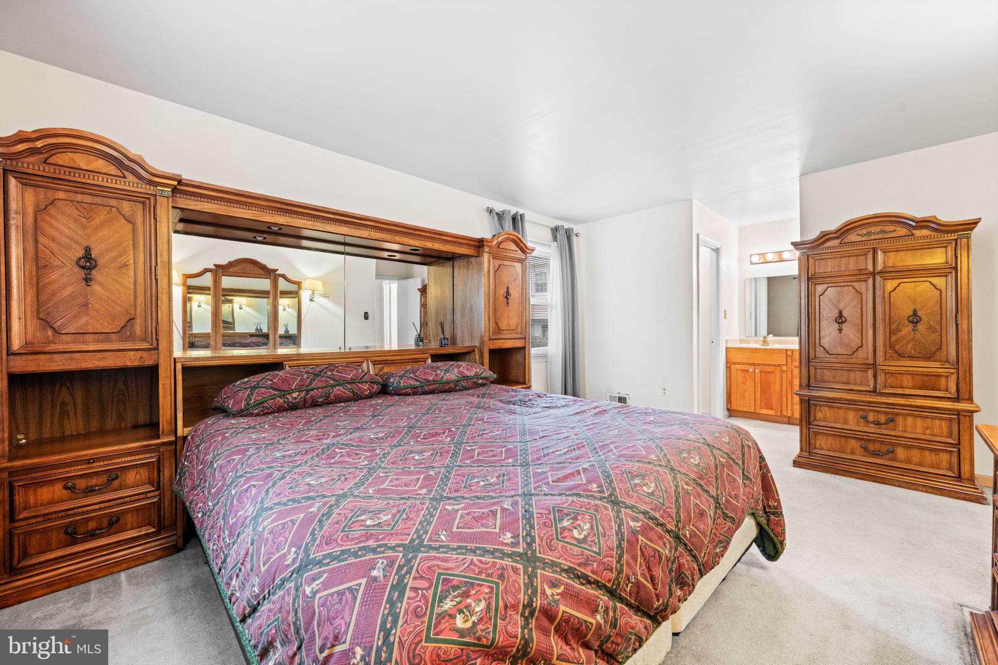 8000 Lady Lewis Court Springfield, VA 22153 - Photo 25 of 44 a bedroom with a bed and wooden floor