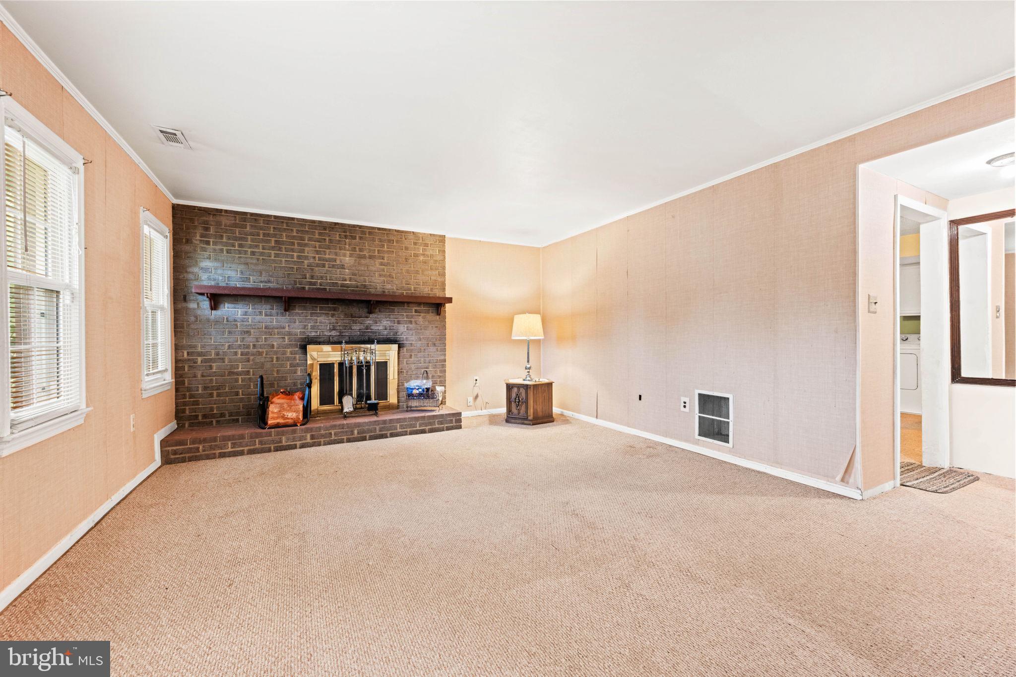 8000 Lady Lewis Court Springfield, VA 22153 - Photo 28 of 44 a view of a livingroom with a fireplace