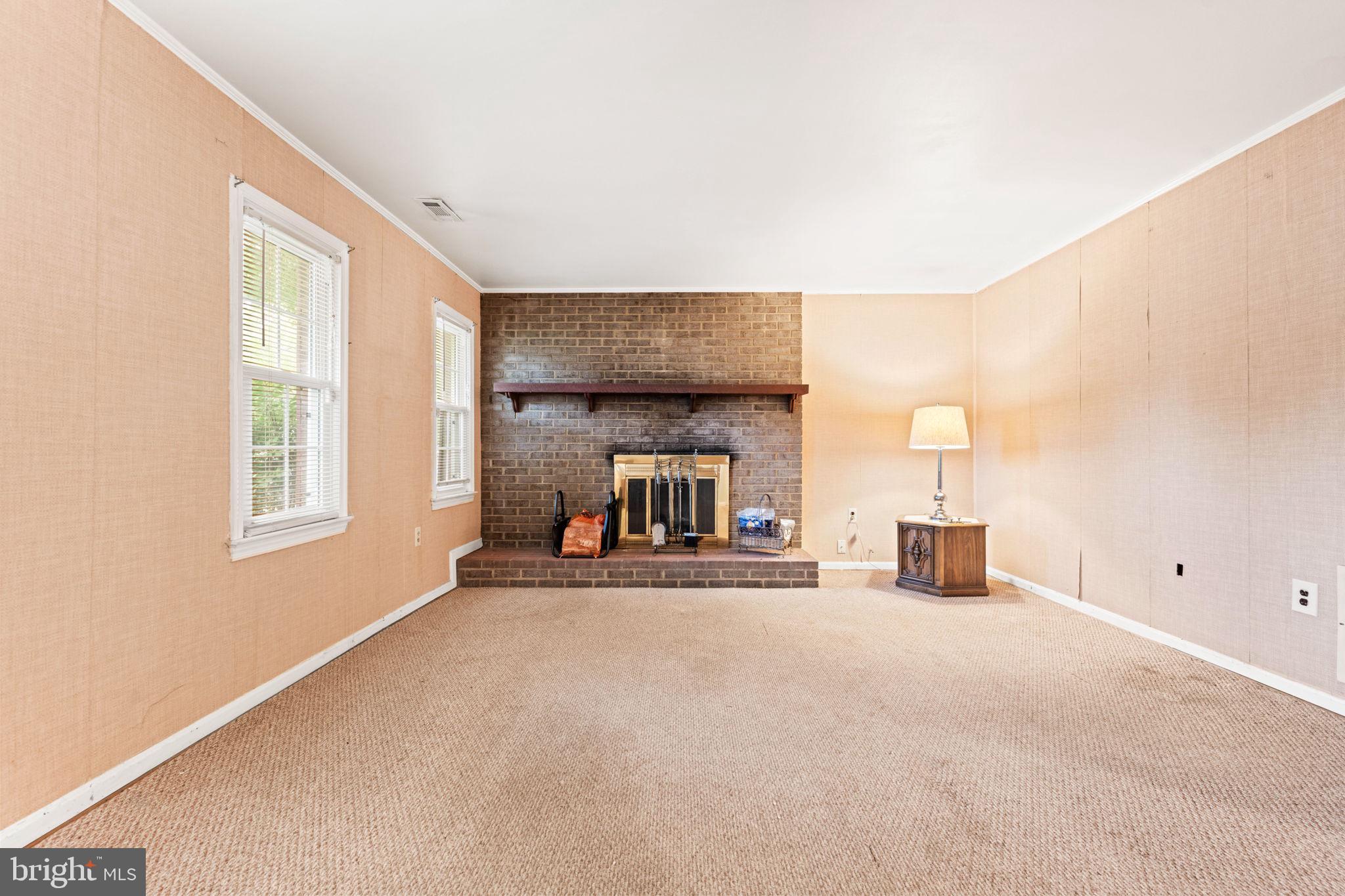 8000 Lady Lewis Court Springfield, VA 22153 - Photo 30 of 44 a view of a livingroom with a couch and a window