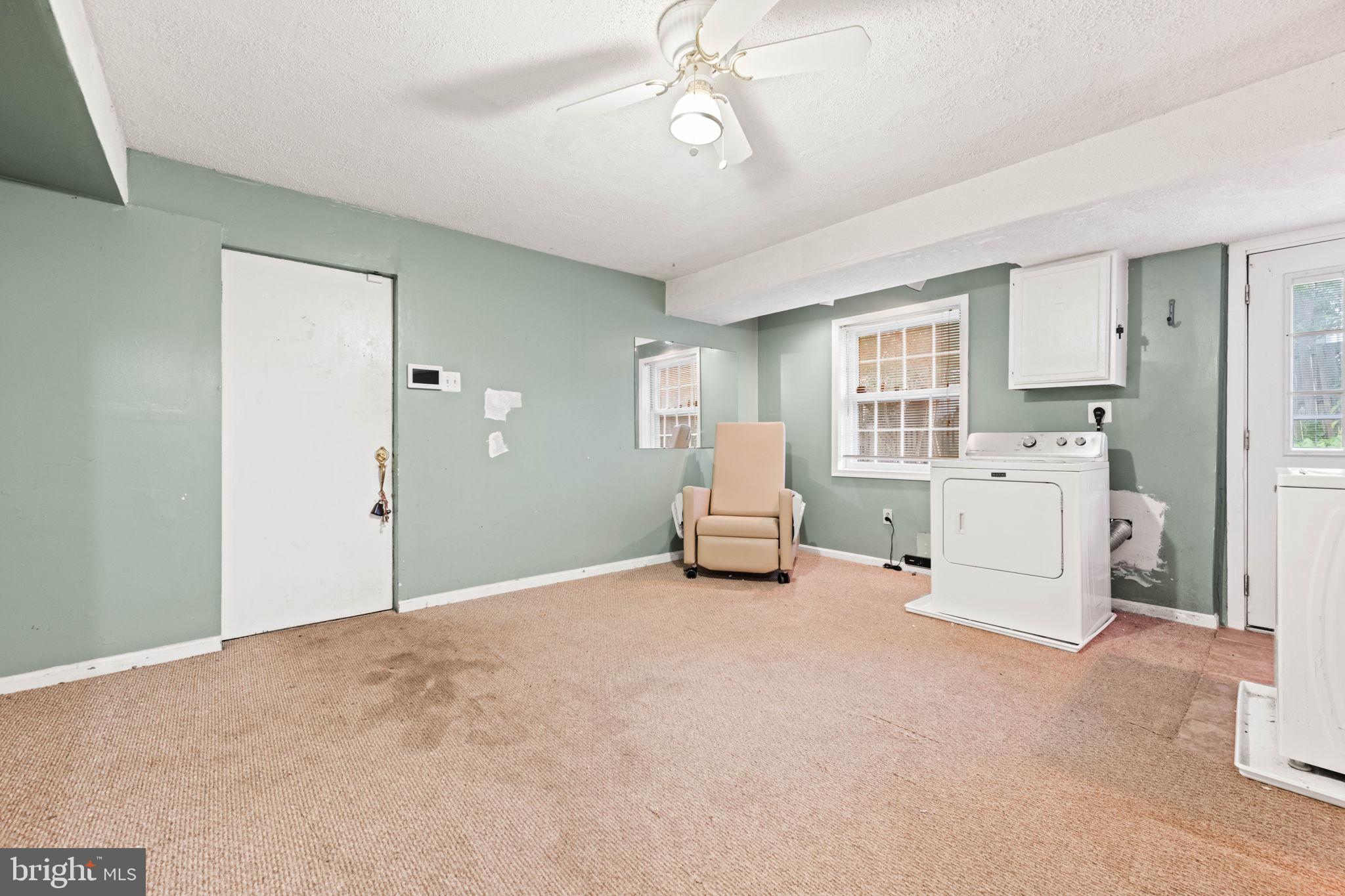 8000 Lady Lewis Court Springfield, VA 22153 - Photo 33 of 44 a view of a livingroom with a chandelier furniture and entryway