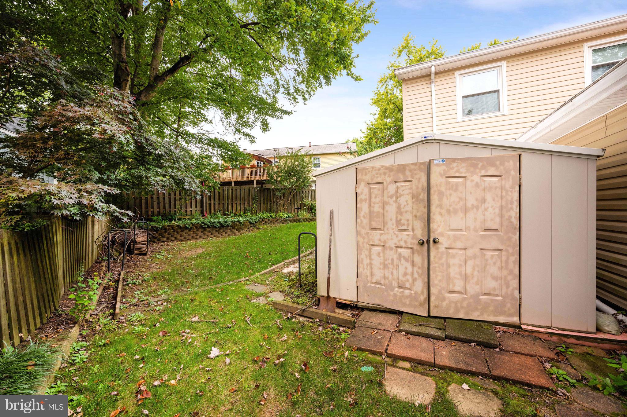 8000 Lady Lewis Court Springfield, VA 22153 - Photo 40 of 44 a backyard of a house with table and chairs