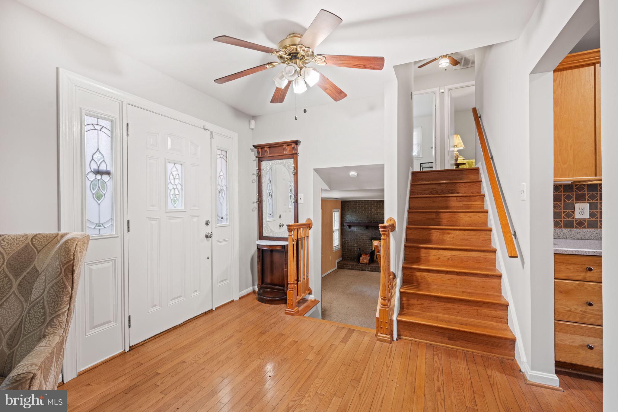 8000 Lady Lewis Court Springfield, VA 22153 - Photo 8 of 44 a view of entryway with wooden floor and stairs