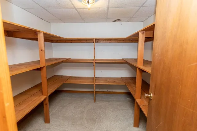 a view of an empty room with a staircase