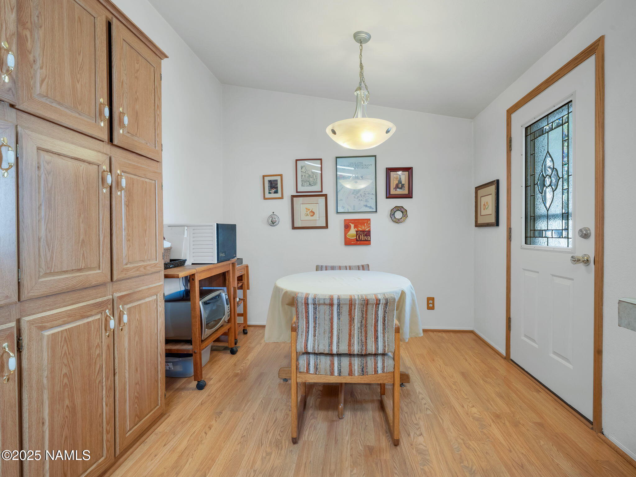 13112 Fallow Deer Road Parks, AZ 86018 - Photo 11 of 39 a bedroom with a bed and wooden floor