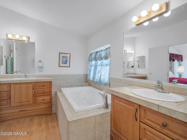 a bathroom with a sink a vanity and a mirror