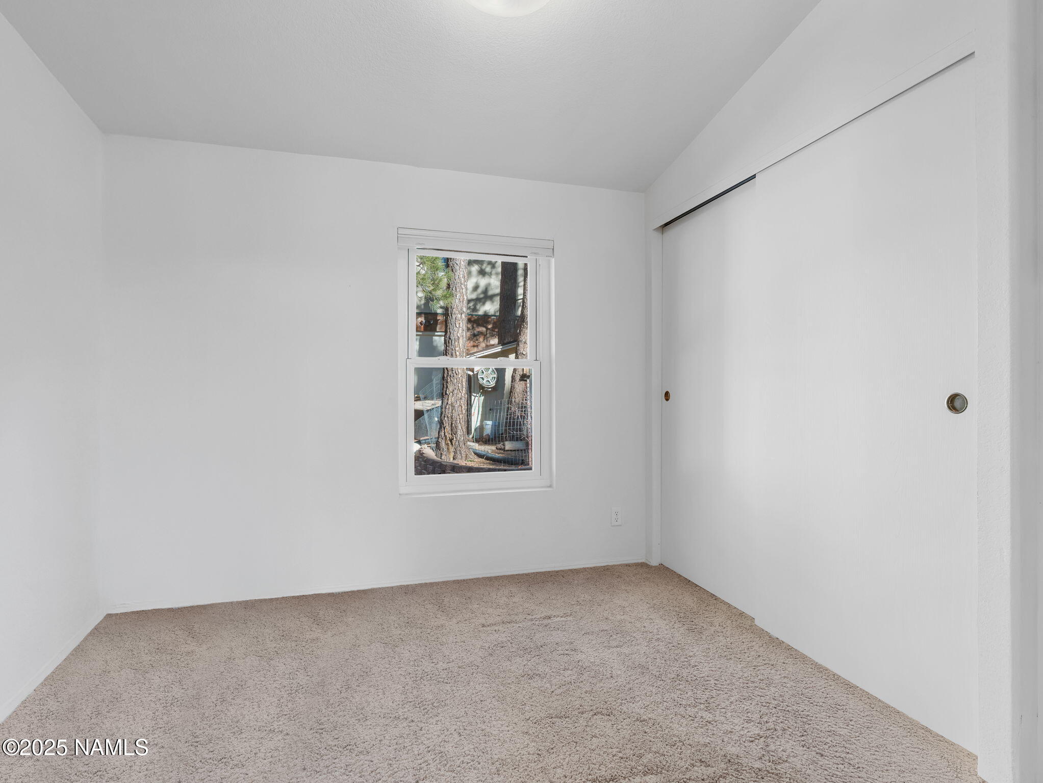 13112 Fallow Deer Road Parks, AZ 86018 - Photo 15 of 39 an empty room with windows