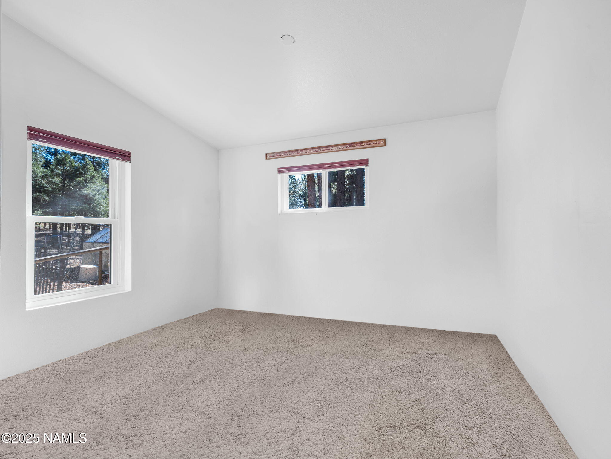 13112 Fallow Deer Road Parks, AZ 86018 - Photo 18 of 39 a view of an empty room with a window