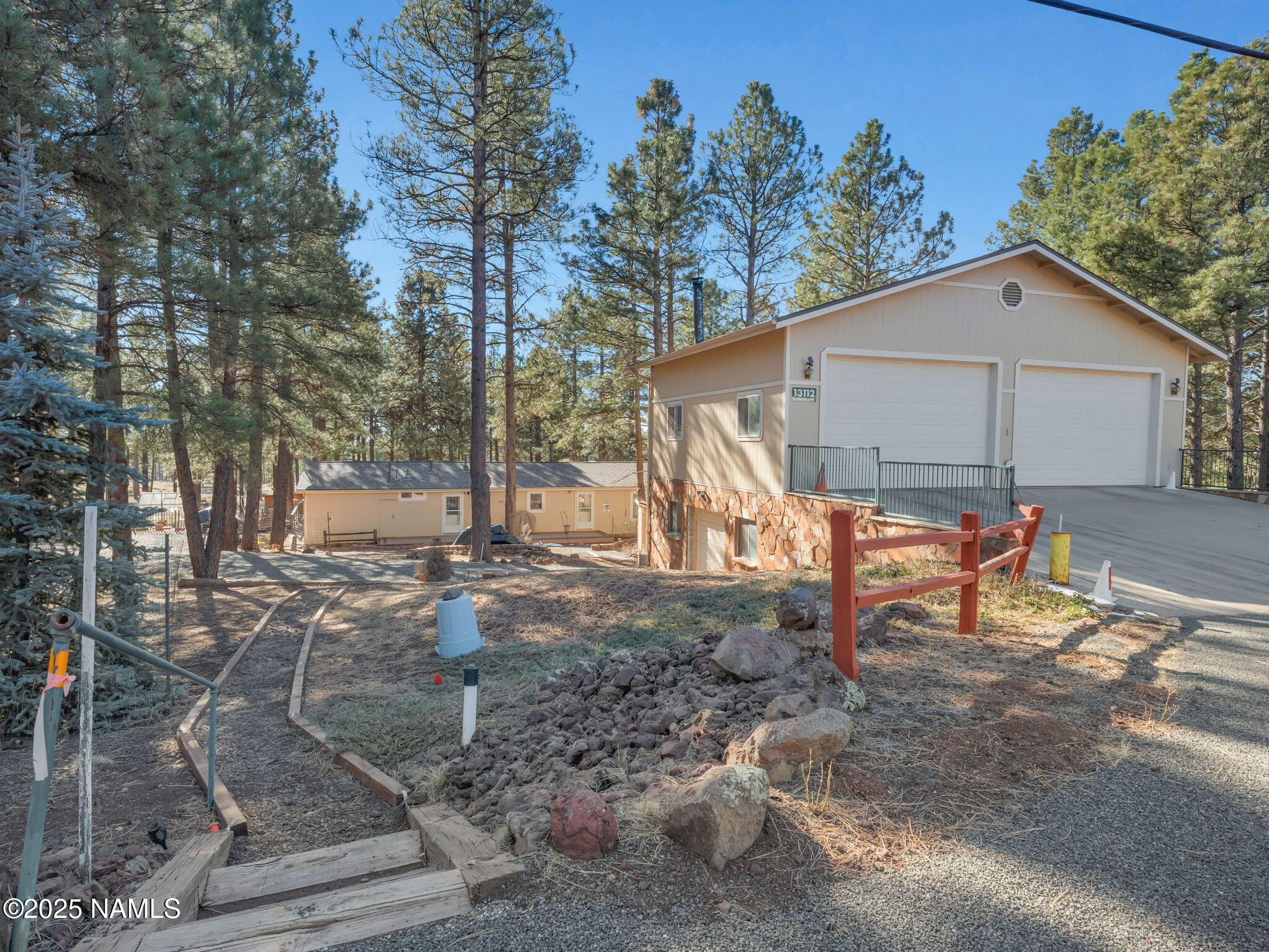 13112 Fallow Deer Road Parks, AZ 86018 - Photo 2 of 39 a view of a house with backyard and sitting area