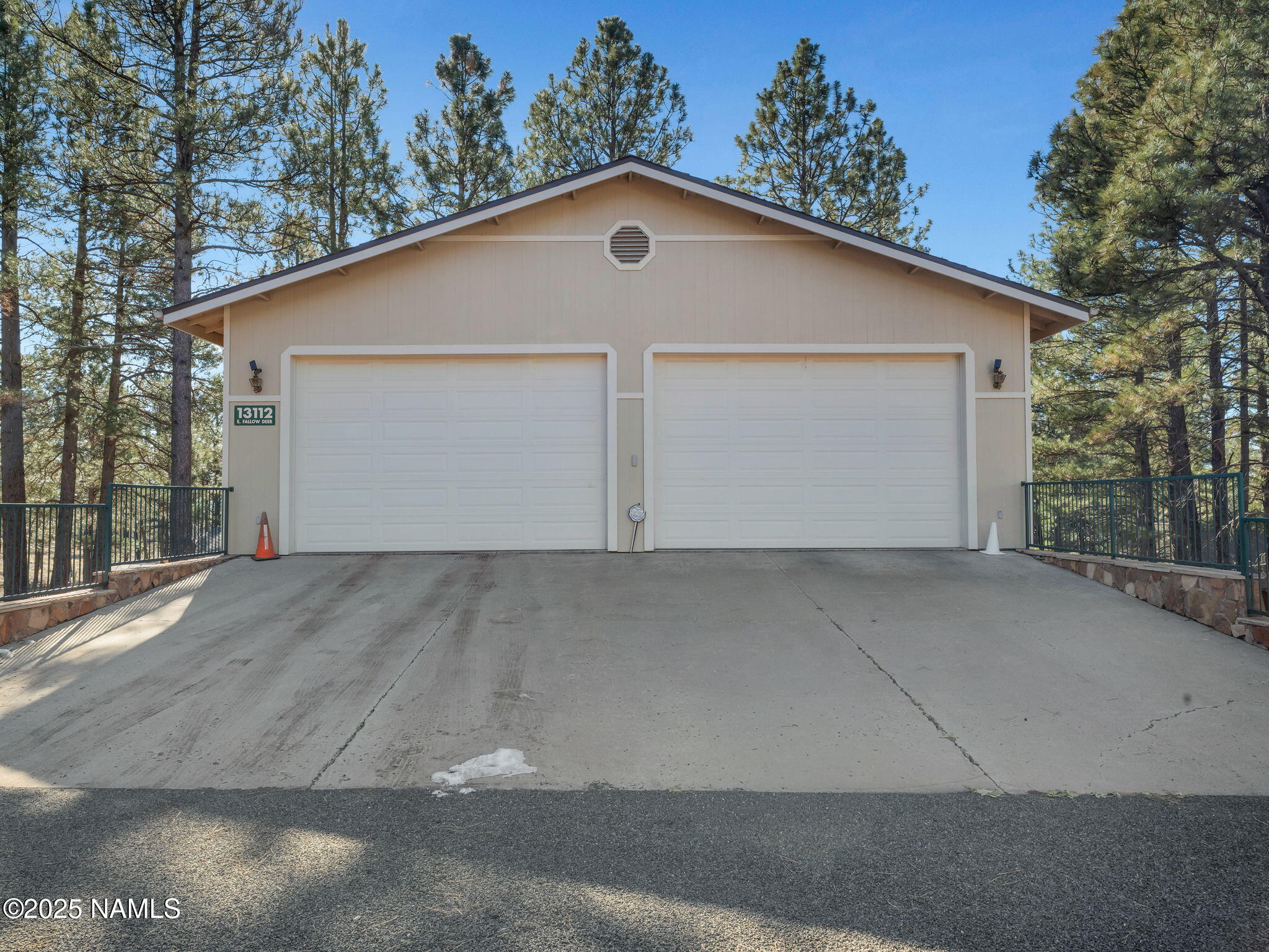 13112 Fallow Deer Road Parks, AZ 86018 - Photo 22 of 39 a front view of a house with a yard and garage