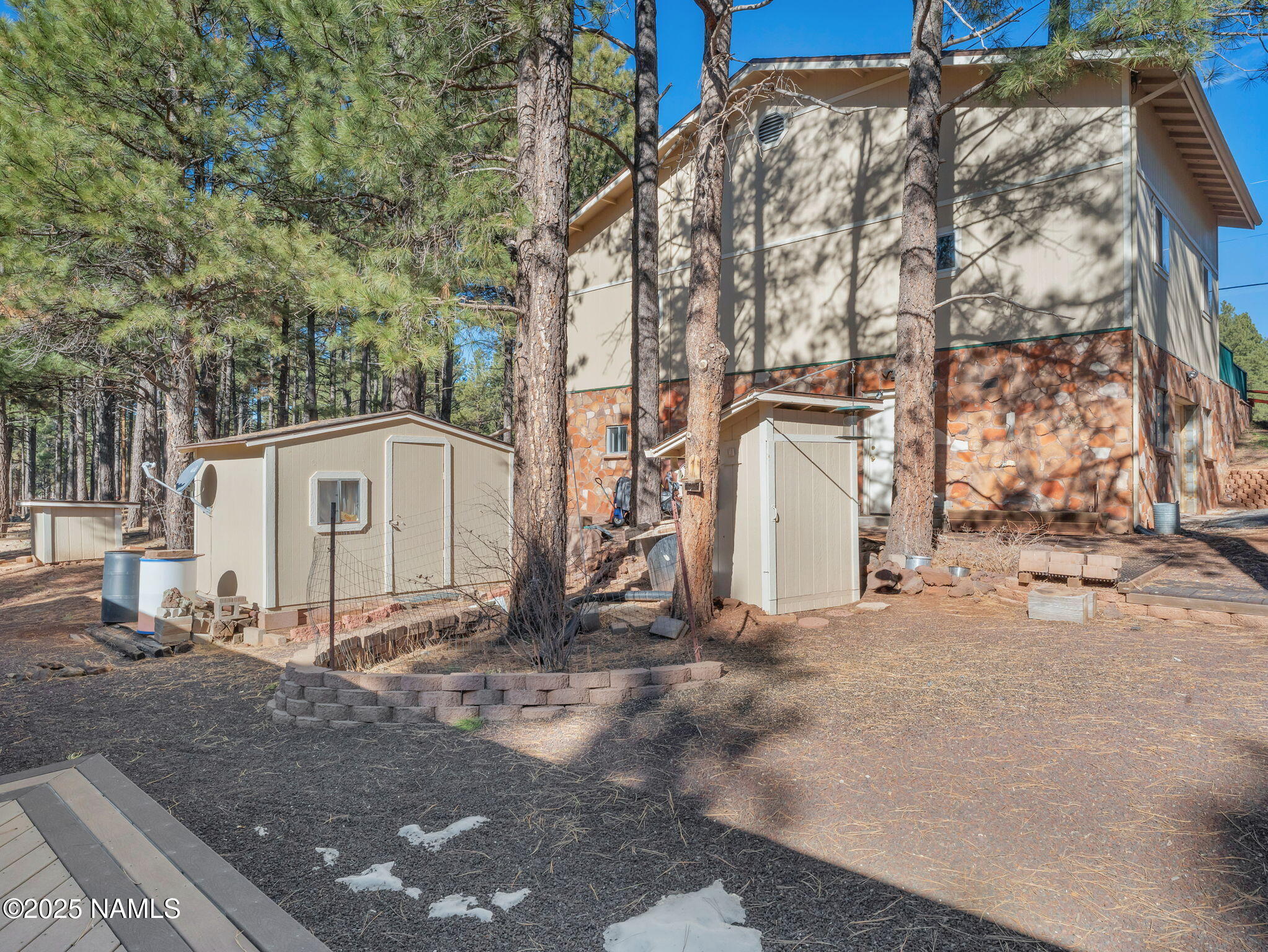 13112 Fallow Deer Road Parks, AZ 86018 - Photo 34 of 39 a view of a white house with a large tree