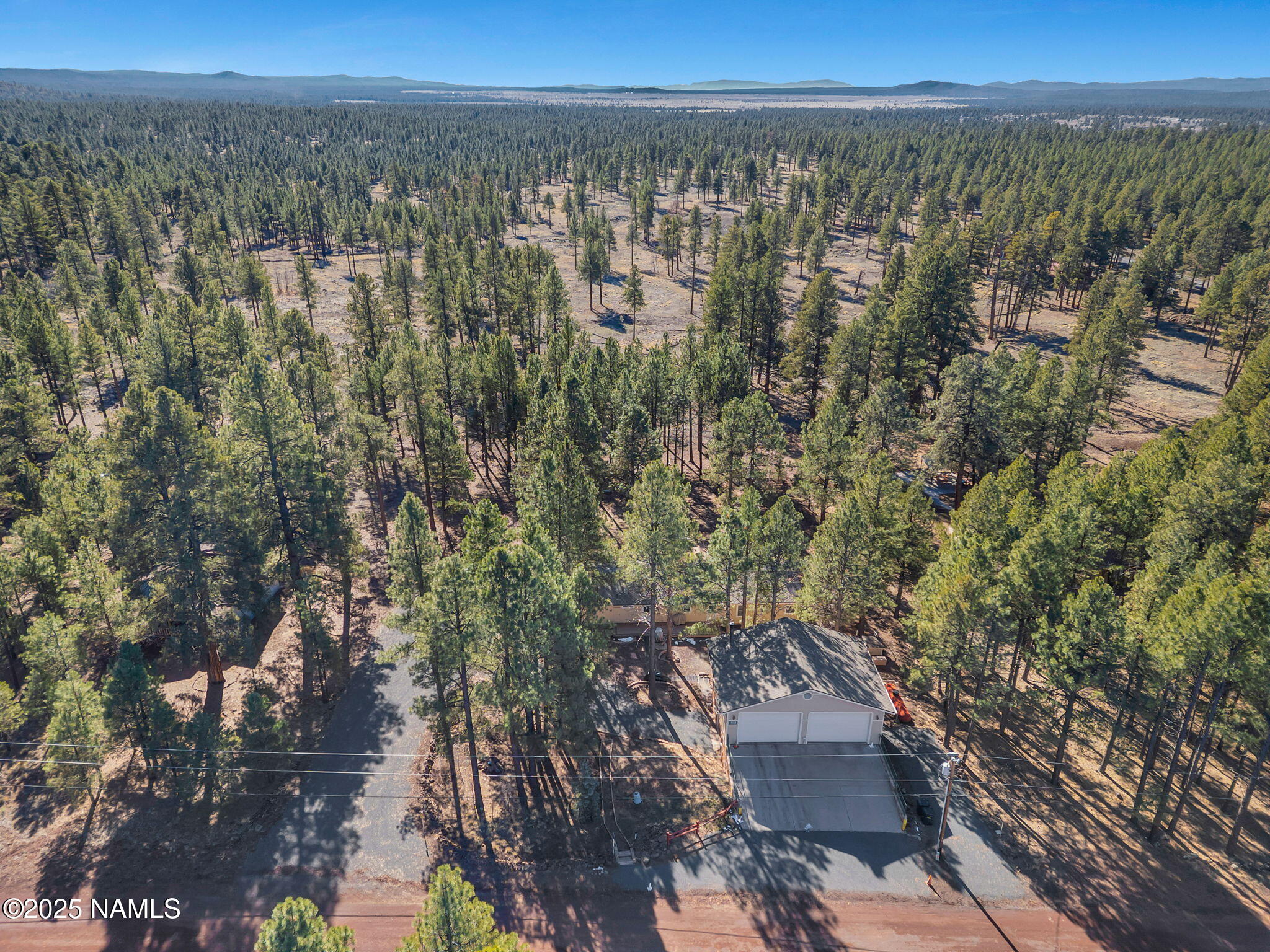 13112 Fallow Deer Road Parks, AZ 86018 - Photo 38 of 39 a view of a city with lush green forest
