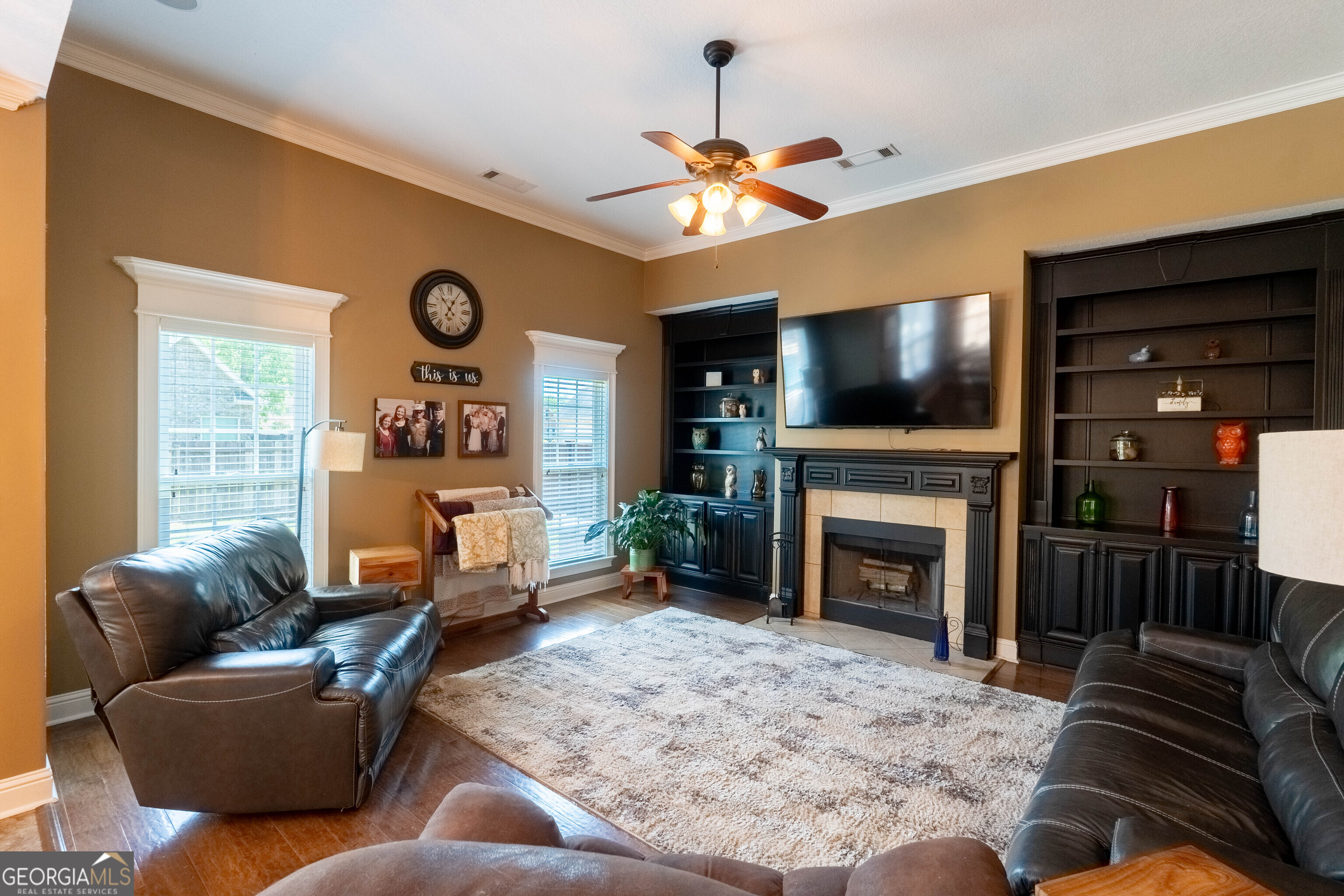 501 Old Bridge Road Warner Robins, GA 31088 - Photo 18 of 54 a living room with furniture a flat screen tv and a fireplace