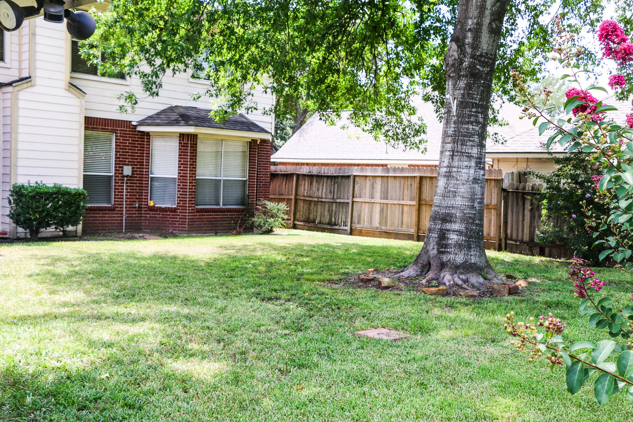 3306 Elmcrest Drive Houston, TX 77088 - Photo 18 of 19 a view of a house with a yard and potted plants