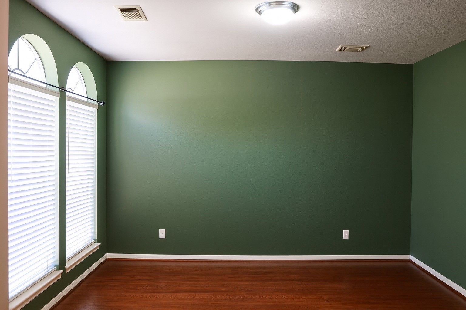 3306 Elmcrest Drive Houston, TX 77088 - Photo 4 of 19 an empty room with wooden floor and windows