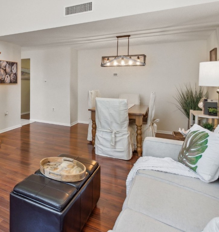 1163 Beach Walker Road, Unit 1163 Fernandina Beach, FL 32034 - Photo 16 of 58 a living room with furniture and a chandelier