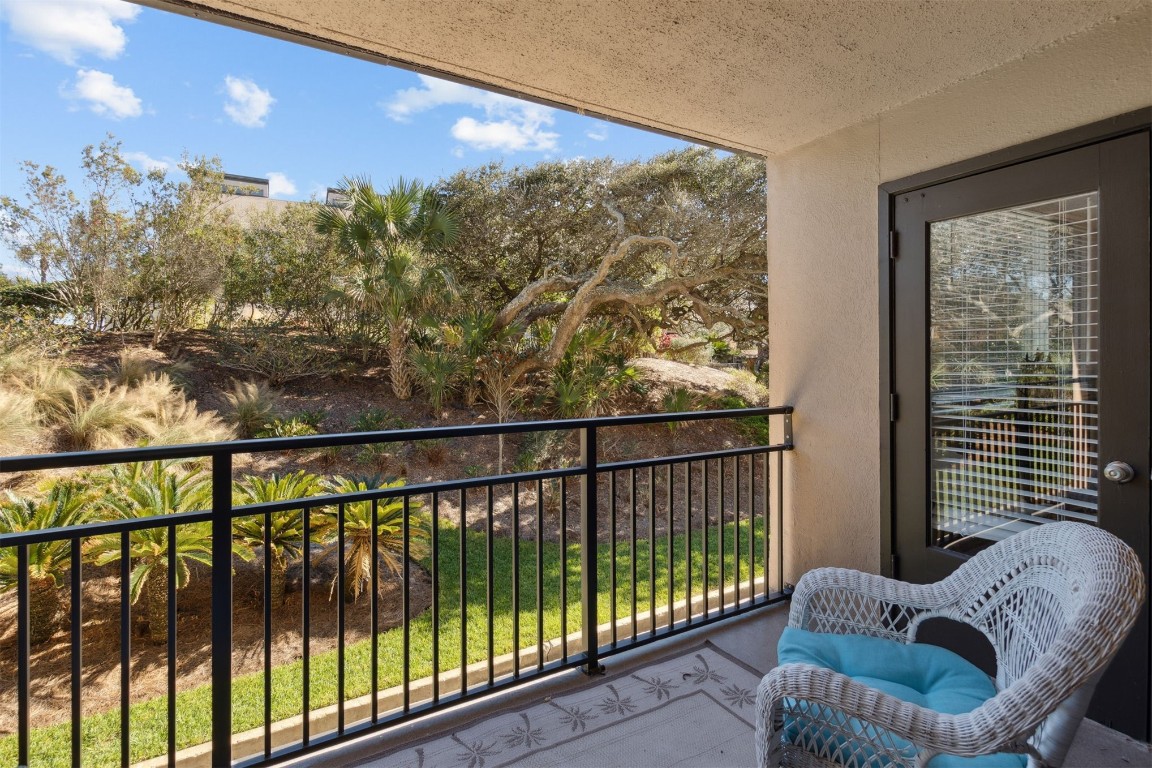 1163 Beach Walker Road, Unit 1163 Fernandina Beach, FL 32034 - Photo 26 of 58 a view of a balcony with furniture