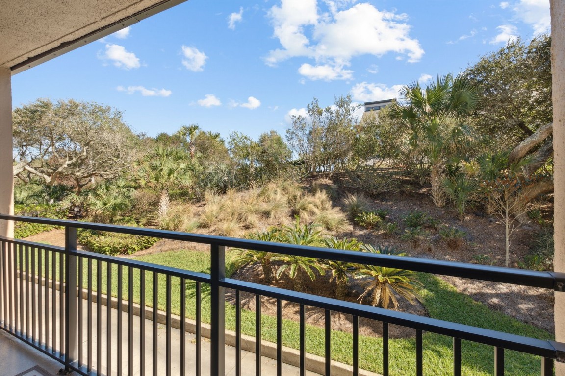 1163 Beach Walker Road, Unit 1163 Fernandina Beach, FL 32034 - Photo 28 of 58 a view of a green yard from a balcony