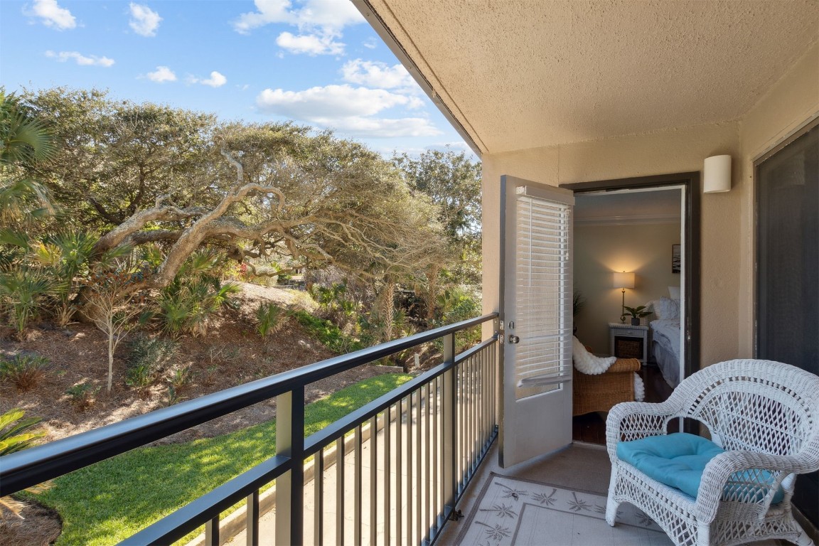 1163 Beach Walker Road, Unit 1163 Fernandina Beach, FL 32034 - Photo 29 of 58 a view of a balcony with furniture