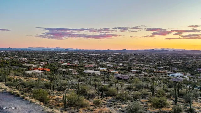 a view of a lush green hillside and a houses