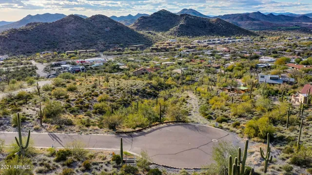a view of a house with a yard and mountain