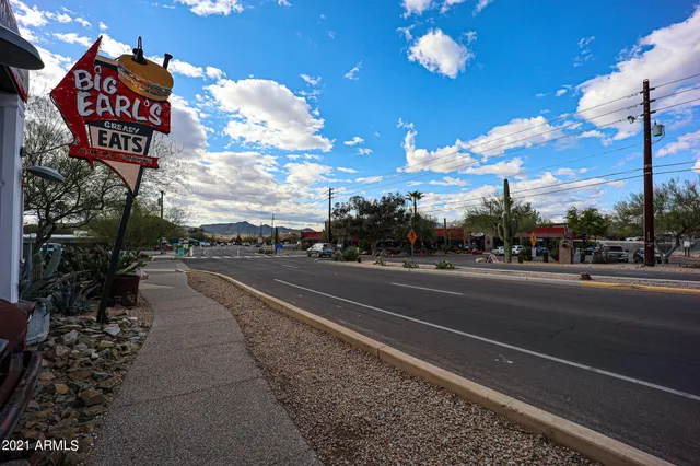 a view of a street with cars on the road