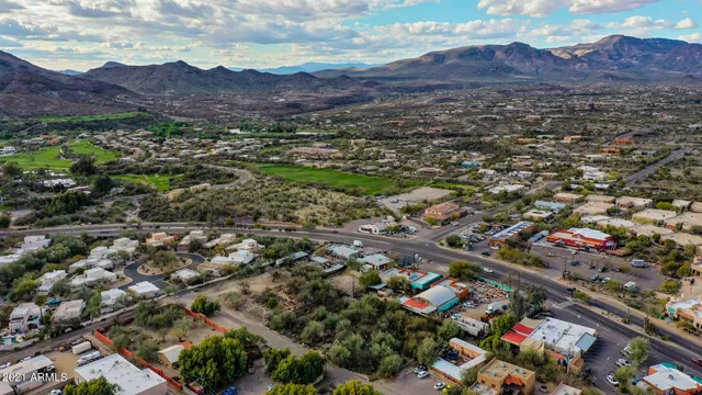 an aerial view of residential house and sandy dunes