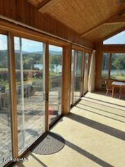 61 Tor Court Pittsfield, MA 01201 - Photo 11 of 32 a bedroom with a bed and a large window