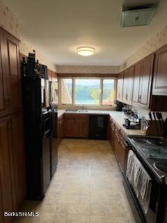 61 Tor Court Pittsfield, MA 01201 - Photo 20 of 32 a kitchen with granite countertop a refrigerator stove and sink