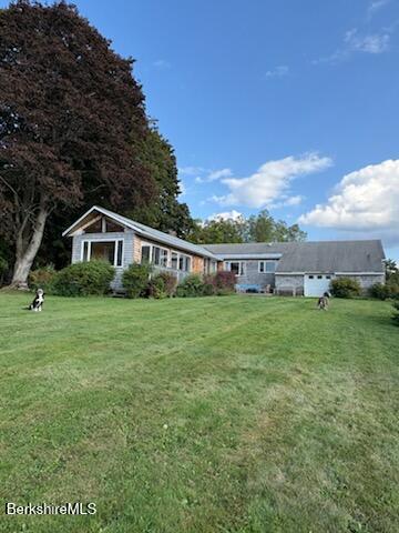 61 Tor Court Pittsfield, MA 01201 - Photo 26 of 32 a front view of house with yard and green space