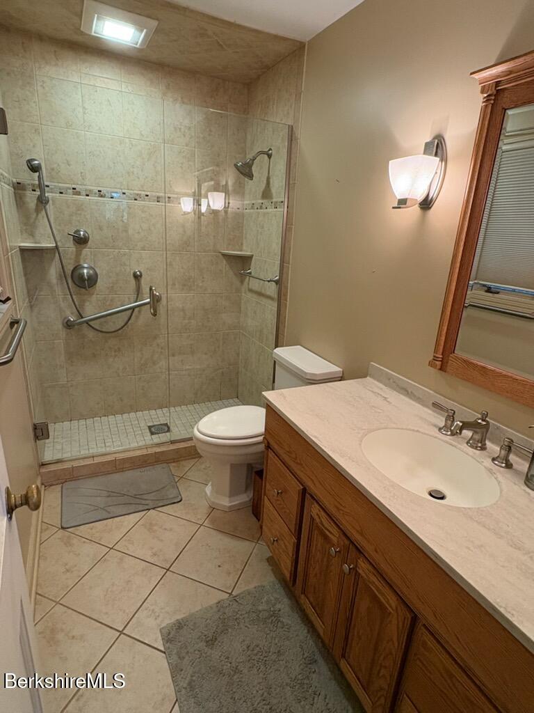 61 Tor Court Pittsfield, MA 01201 - Photo 28 of 32 a bathroom with a sink a toilet and shower