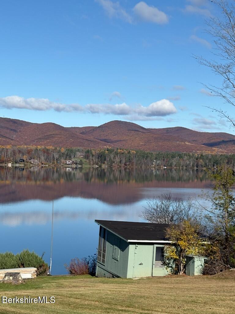 61 Tor Court Pittsfield, MA 01201 - Photo 30 of 32 a view of a lake with mountains in the background