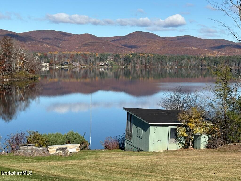 61 Tor Court Pittsfield, MA 01201 - Photo 32 of 32 a view of a lake with a mountain in the background