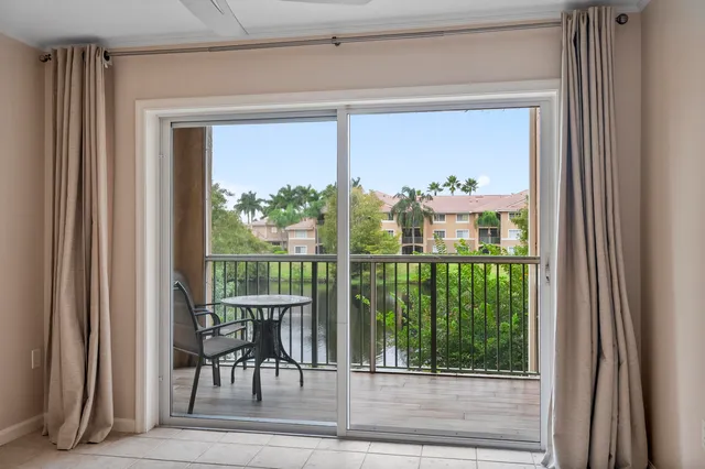 a view of a porch with a floor to ceiling window