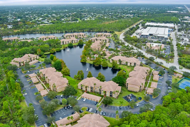 an aerial view of lake residential houses with outdoor space and lake view