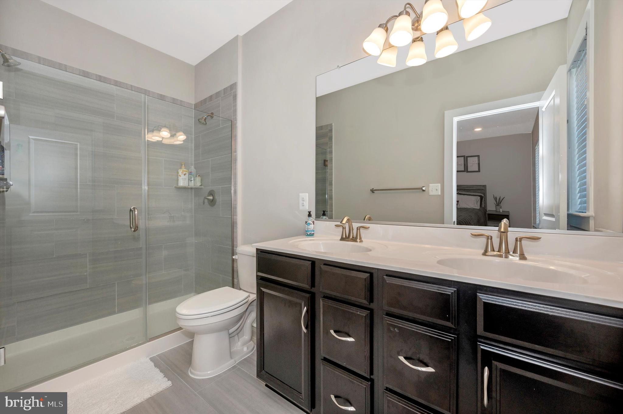 8508 Randell Ridge Road Frederick, MD 21704 - Photo 25 of 45 Tiled Shower and Double Sink