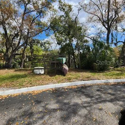 a view of a backyard with chairs
