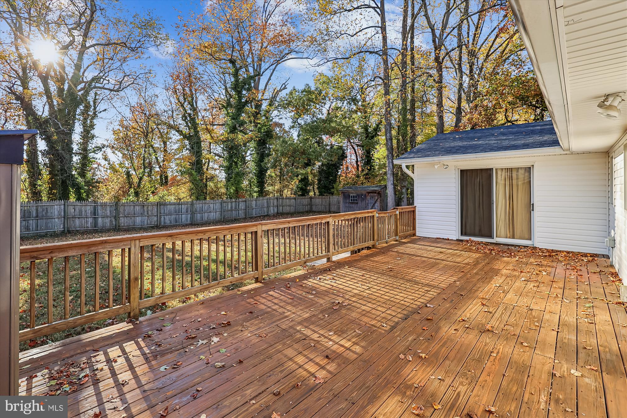 1506 Widows Mite Road Edgewater, MD 21037 - Photo 25 of 66 a view of backyard with a deck and wooden floor