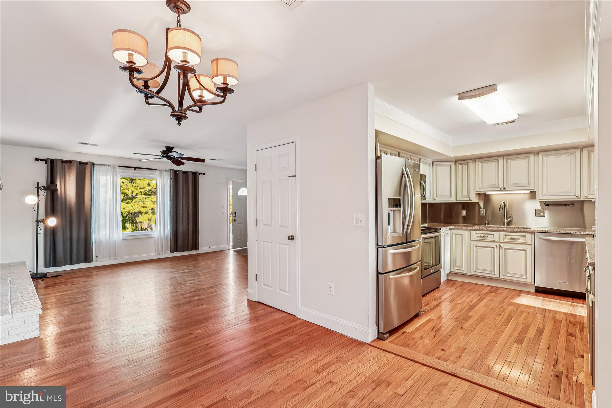1506 Widows Mite Road Edgewater, MD 21037 - Photo 26 of 66 a kitchen with stainless steel appliances granite countertop a refrigerator and a stove top oven
